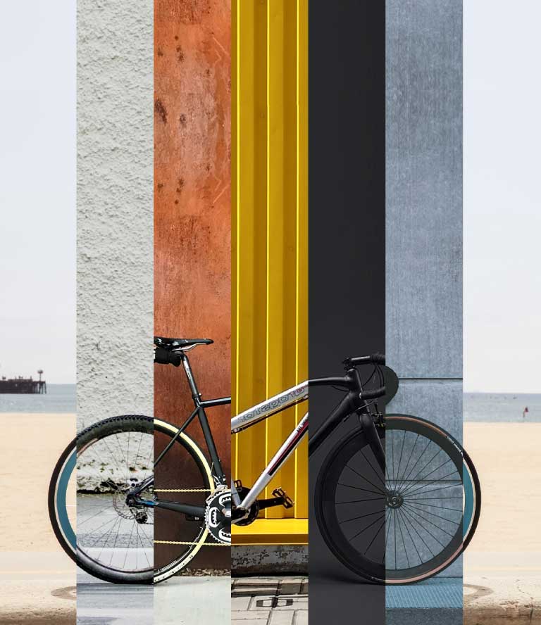 On display is a bicycle leaning against a colorful wall