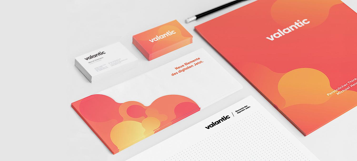 A collections shows business cards, booklets and whitepapers in new brand CI